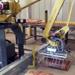 bag palletizing robot picks up and palletizes 50lb bags of creep cattle feed 002