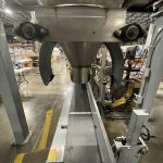 side view of small bag filing machine with pneumatic bag clamps