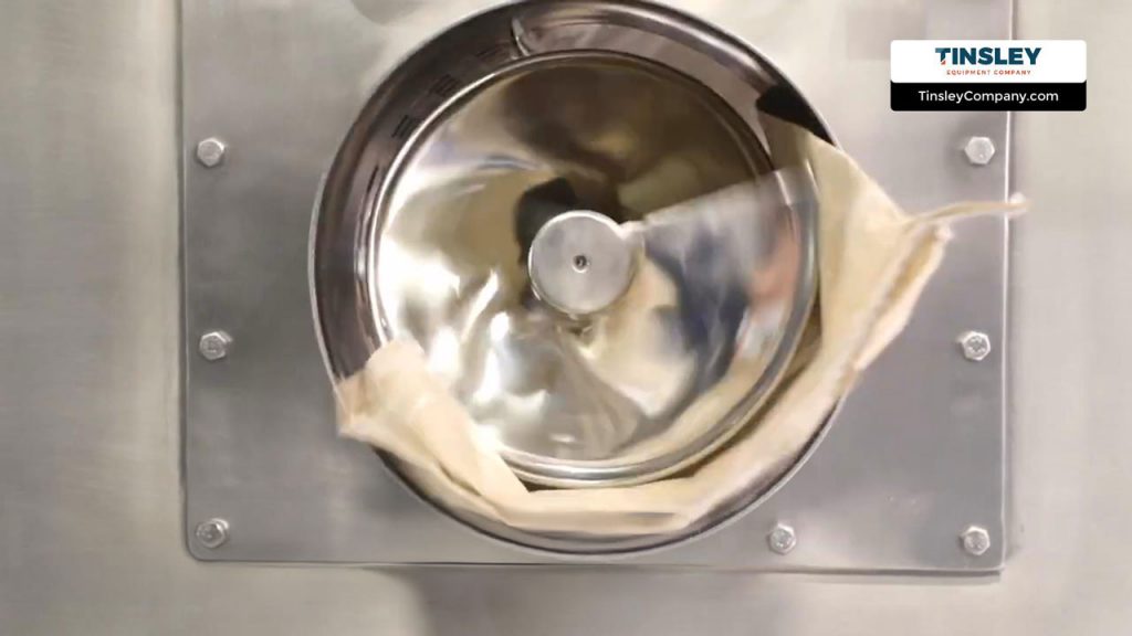 auger discharges discarded bag