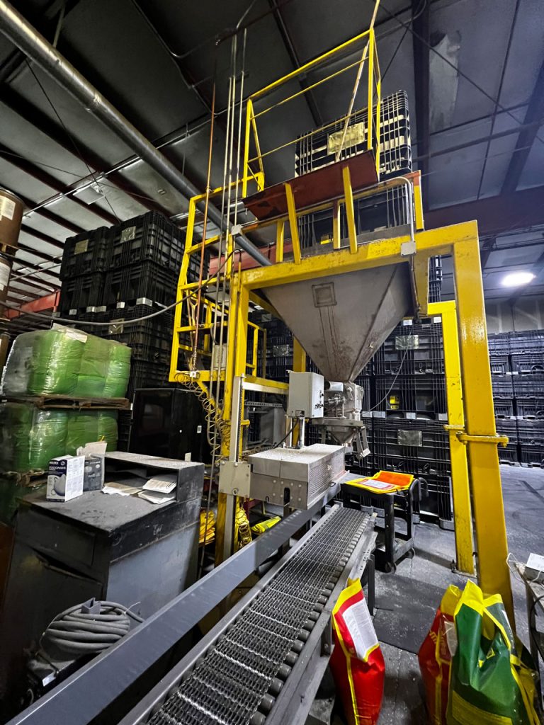 side view of fertilizer bagging system with discharge stand and hopper for buckhorn centerflow seed box