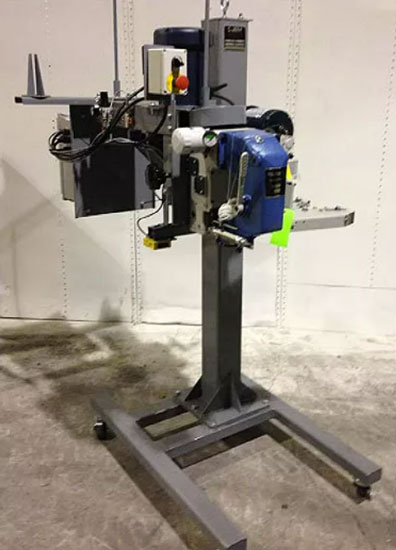 union special bag sewing head mounted on sewing pedestal with power infeed