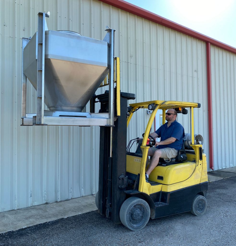 IBC container being raised by forklift