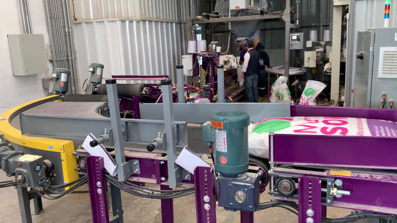 livestock feed bagging plant, bag sewing system, and bag handling conveyors