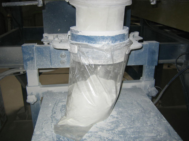 5 pound plastic bag being filled with Titanium Dioxide and Calcium Carbonate 5 pound plastic bag being filled with Titanium Dioxide and Calcium Carbonate