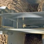 view of dog food being fed into duplex 2 internal weigh hoppers