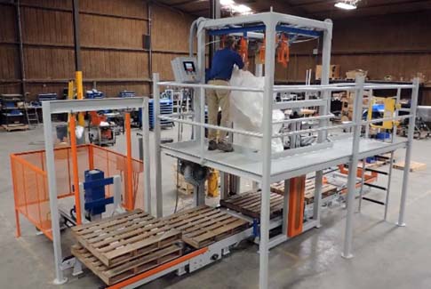 hanging empty bulk bag inside of bulk bag filling system