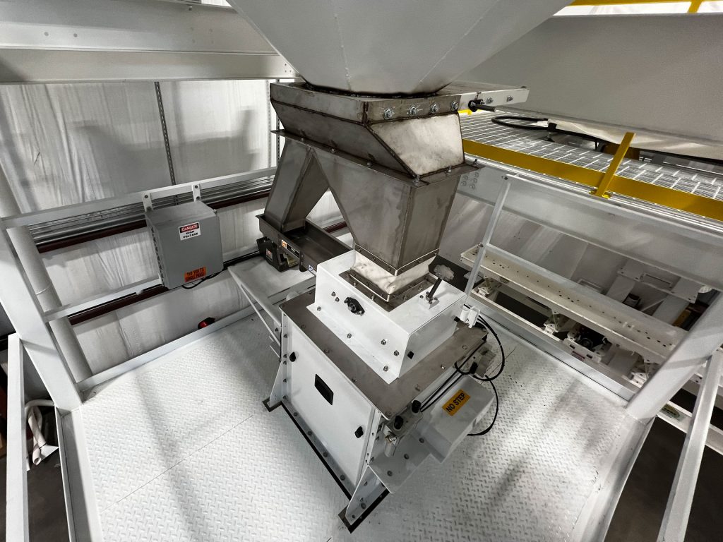 manual slide gate pants leg transition hopper to net weigher to dribble feeder bulk gravity gate into internal weigh hopper