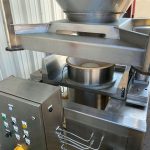 ibc container being lowered onto discharge station