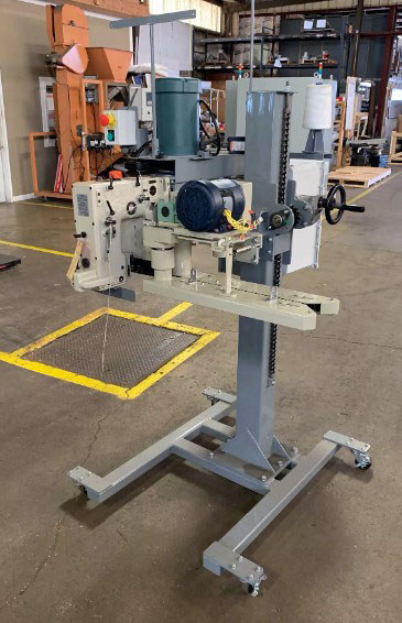 Newlong DS-9C mounted on industrial bag sewing system pedestal
