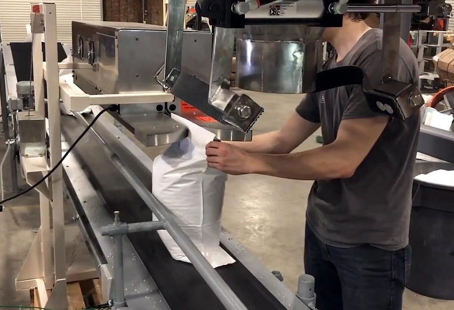 Bag Closing Conveyor Closes Bags filled with Seeds