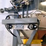 side view of bag filling machine for grass fertilizer using a digital gross weight bagging scale