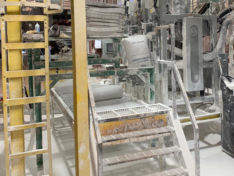 bag discharge conveyor with operator seat