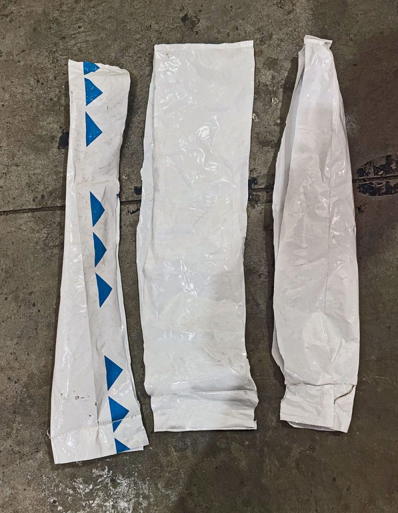 opened and sliced poly plastic bag for 50 lbs of chemical powders