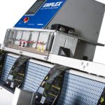 bags of coffee on horizontal and angled bag sealer ACS series