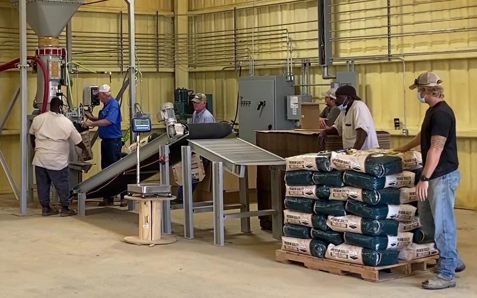 bag incline conveyor to gravity roller table