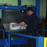 50 pound bag unloading station for adding additional ingredients to batching system